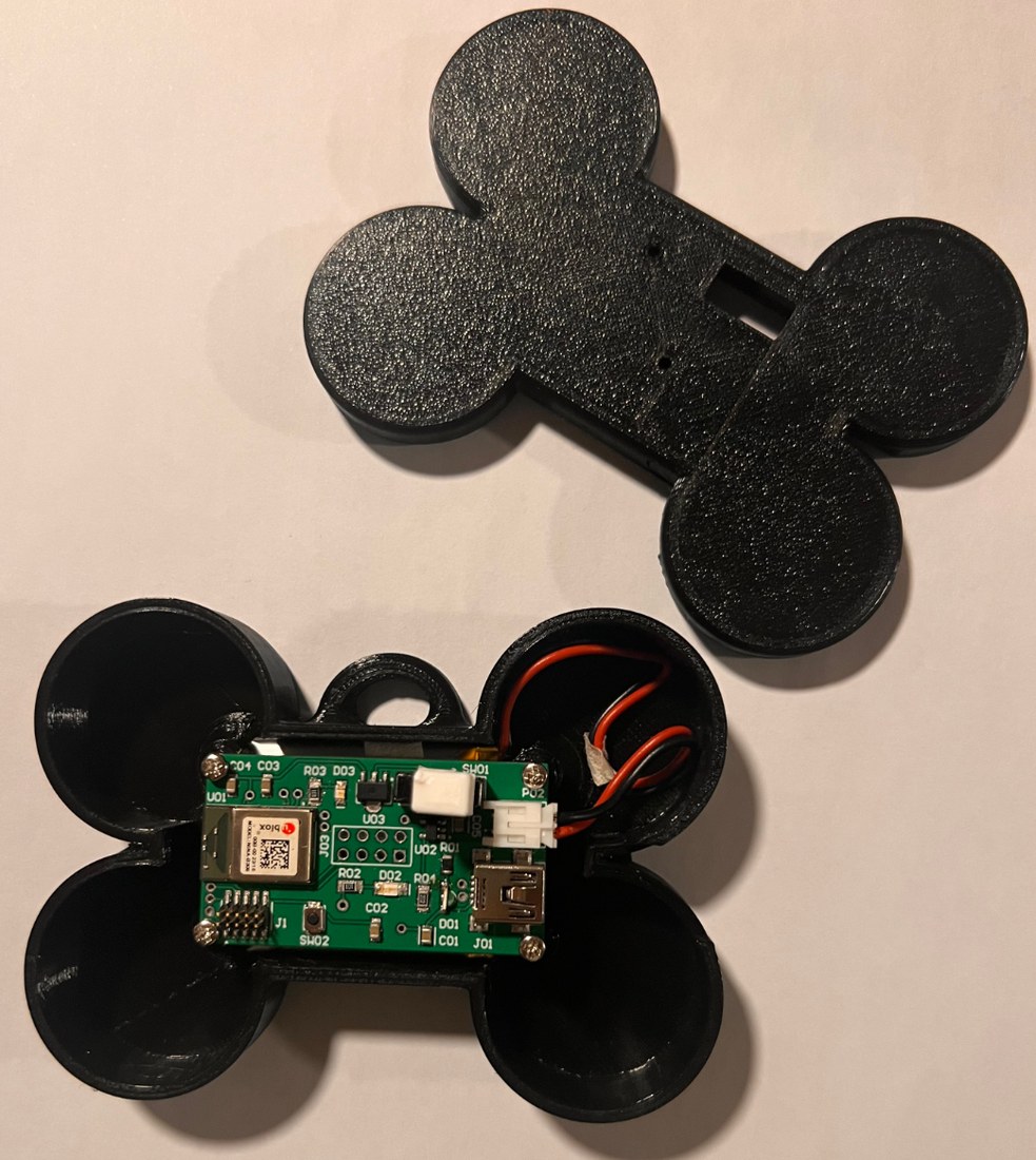 The mobile node assembled inside a 3D-printed bone-shaped enclosure with the PCB visible.